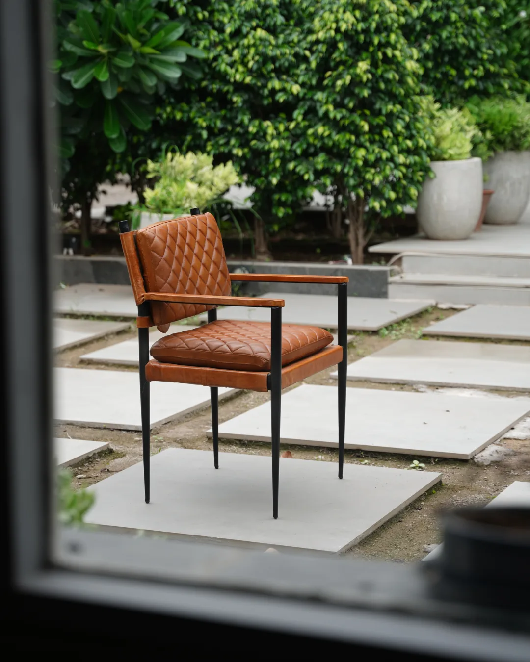 The Atelier Chair — Diamond-Quilted Tan Leather & Blackened Iron Armchair, Industrial-Heritage Design
